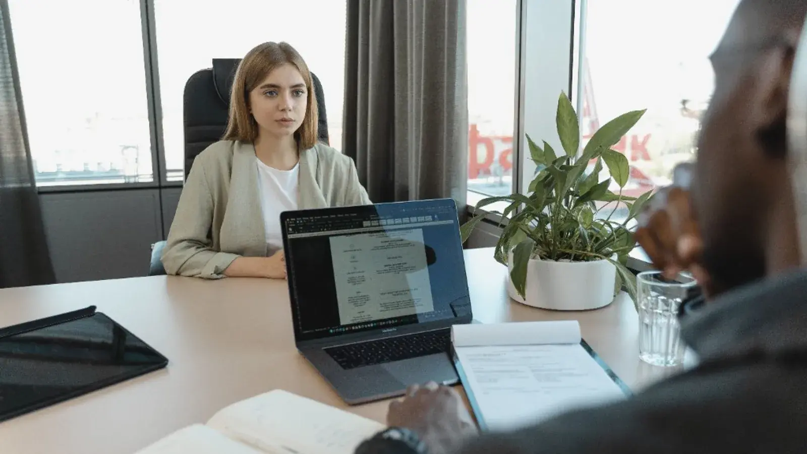 Professional consultation meeting assessing career and earnings options in a modern office